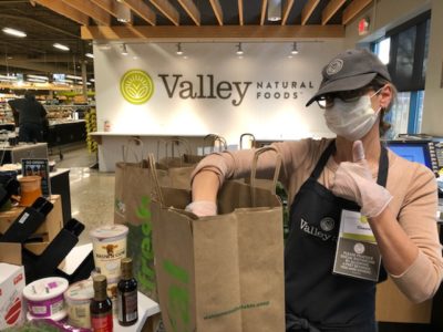 Packing Groceries while wearing a face mask